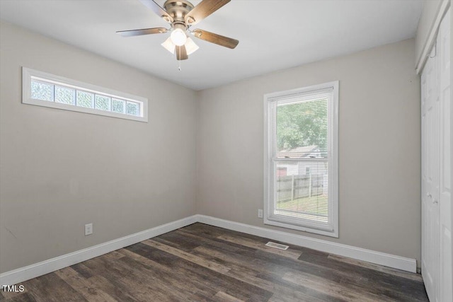 111 Mcdole Cir, Cary, NC 27511 - spare room featuring healthy amount of natural light, baseboards, and dark wood-type flooring