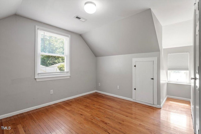 111 Mcdole Cir, Cary, NC 27511 - bonus room with lofted ceiling, light wood-style floors, and baseboards