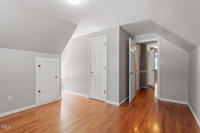 111 Mcdole Cir, Cary, NC 27511 - bonus room featuring light wood-style flooring, vaulted ceiling, and baseboards