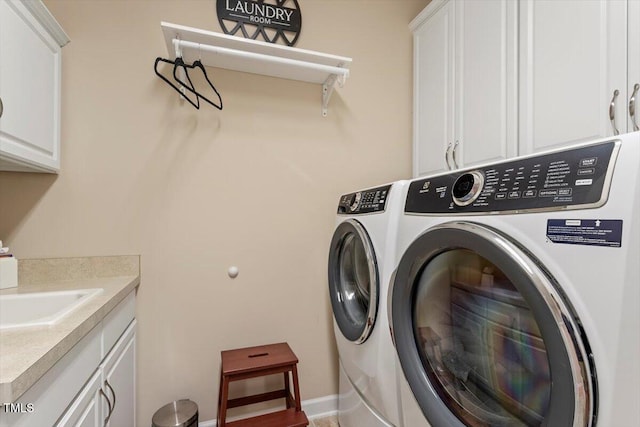 228 Ellisview Dr, Cary, NC 27519 - laundry room featuring cabinet space and washing machine and dryer