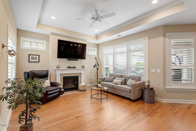 228 Ellisview Dr, Cary, NC 27519 - living area with a raised ceiling, light wood-style floors, ceiling fan, ornamental molding, and plenty of natural light