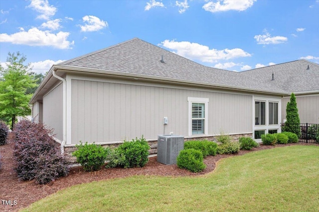 228 Ellisview Dr, Cary, NC 27519 - view of side of property with cooling unit, roof with shingles, and stone siding