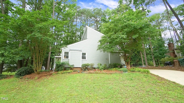516 Ryan Rd, Cary, NC 27511 - view of property exterior featuring a lawn