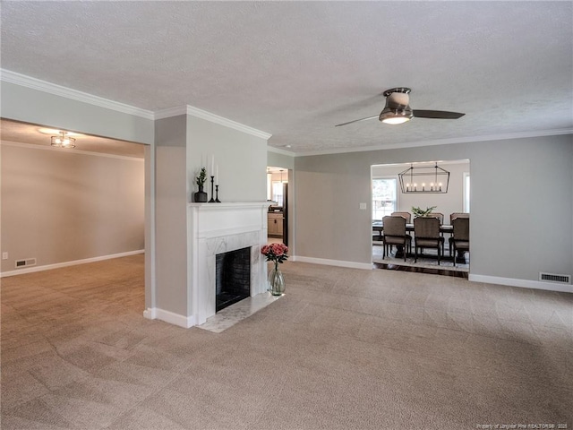 5307 N Fayetteville Rd, Lumberton, NC 28360 - living area featuring ornamental molding, ceiling fan, a tiled fireplace, light colored carpet, and a textured ceiling