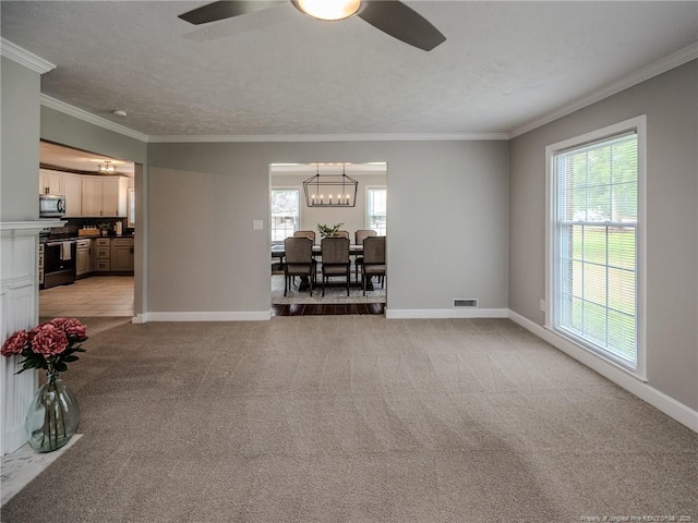5307 N Fayetteville Rd, Lumberton, NC 28360 - living room with a ceiling fan, a chandelier, healthy amount of natural light, crown molding, and light colored carpet