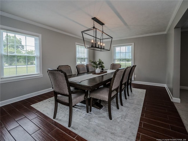 5307 N Fayetteville Rd, Lumberton, NC 28360 - dining room with wood tiled floors, a chandelier, baseboards, and ornamental molding