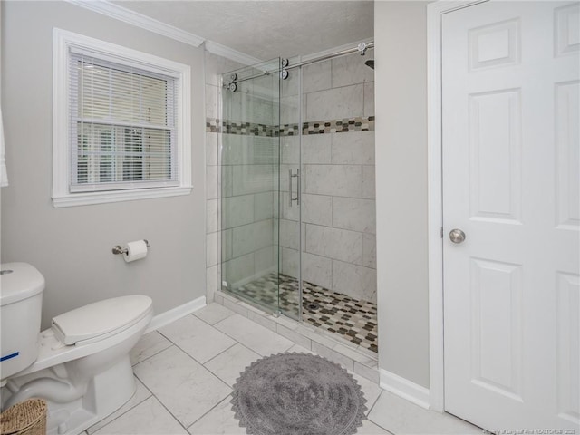 5307 N Fayetteville Rd, Lumberton, NC 28360 - bathroom featuring ornamental molding, toilet, a shower stall, and baseboards