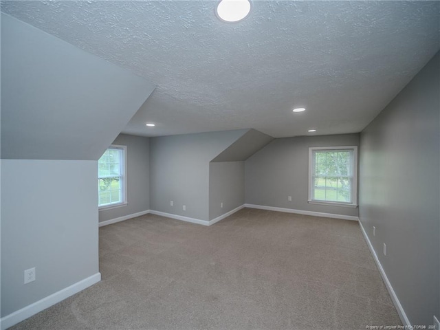 5307 N Fayetteville Rd, Lumberton, NC 28360 - additional living space with a textured ceiling, carpet flooring, baseboards, recessed lighting, and plenty of natural light