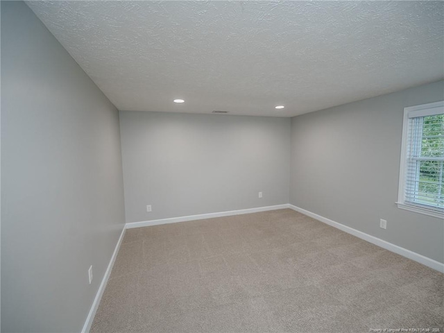 5307 N Fayetteville Rd, Lumberton, NC 28360 - spare room with a textured ceiling, baseboards, light colored carpet, and recessed lighting