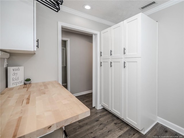 5307 N Fayetteville Rd, Lumberton, NC 28360 - kitchen featuring white cabinets, crown molding, dark wood-style flooring, recessed lighting, and baseboards