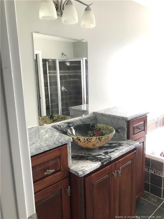 330 Bubble Creek Ct Unit 8, Fayetteville, NC 28311 - bathroom featuring vanity, tiled tub, an enclosed shower, and tile patterned floors