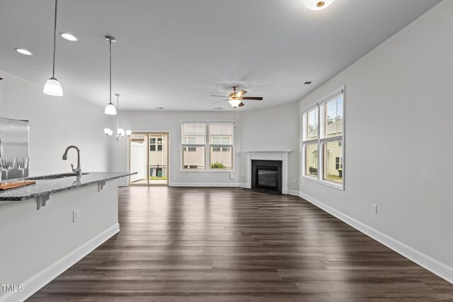 1102 Latitude Dr, Durham, NC 27713 - unfurnished living room with a sink, ceiling fan, recessed lighting, baseboards, and dark wood finished floors