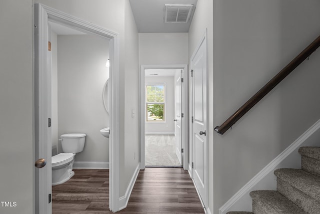 1102 Latitude Dr, Durham, NC 27713 - bathroom with wood finished floors, toilet, and baseboards
