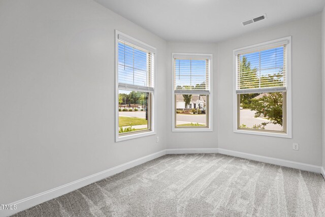 1102 Latitude Dr, Durham, NC 27713 - carpeted empty room with baseboards