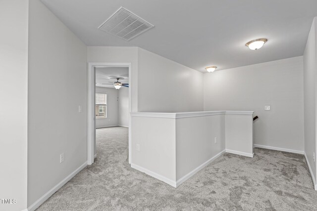 1102 Latitude Dr, Durham, NC 27713 - hallway with an upstairs landing, carpet flooring, and baseboards