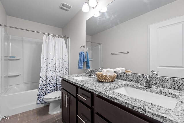 1102 Latitude Dr, Durham, NC 27713 - full bath with tile patterned flooring, double vanity, shower / bath combo with shower curtain, and toilet