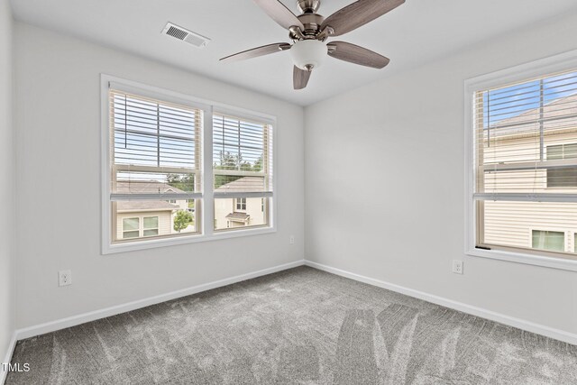 1102 Latitude Dr, Durham, NC 27713 - carpeted spare room with baseboards and a ceiling fan