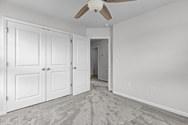 1102 Latitude Dr, Durham, NC 27713 - unfurnished bedroom featuring carpet, a closet, baseboards, and a ceiling fan