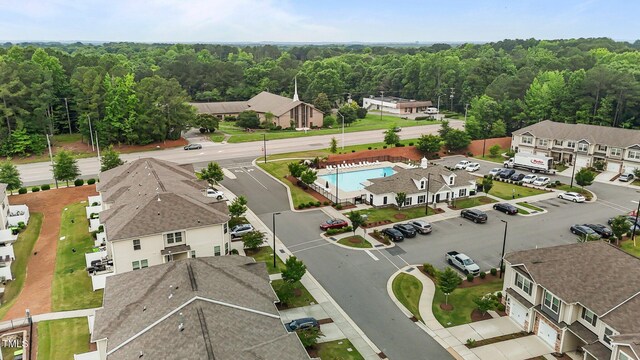 1102 Latitude Dr, Durham, NC 27713 - drone / aerial view of a heavily wooded area and a pool