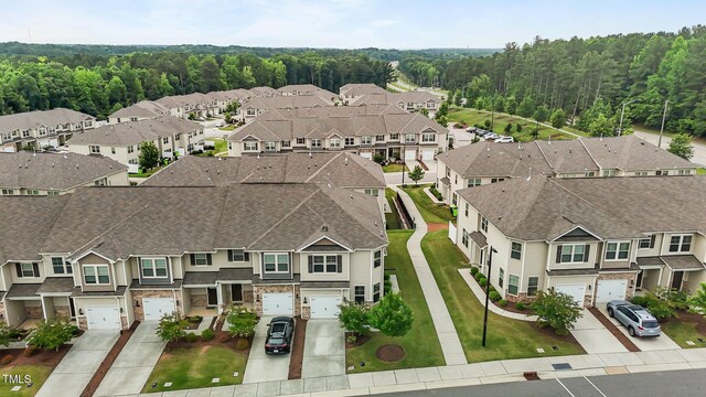 1102 Latitude Dr, Durham, NC 27713 - aerial view of residential area featuring a heavily wooded area