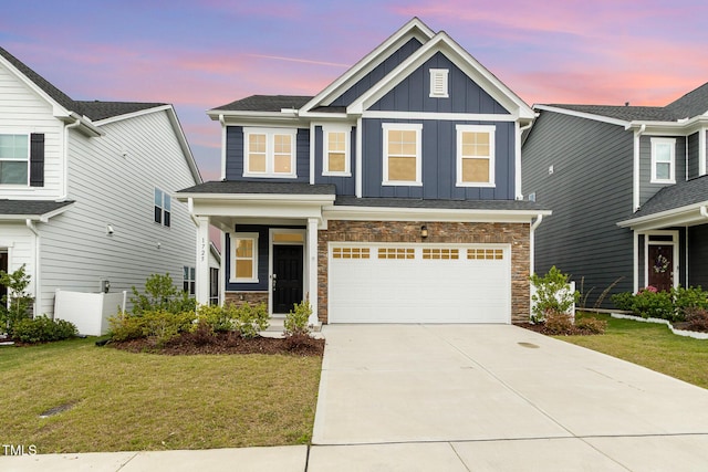 1725 Winter Jasmine Ln, Wake Forest, NC 27587 - craftsman-style house featuring board and batten siding, concrete driveway, an attached garage, a front lawn, and stone siding