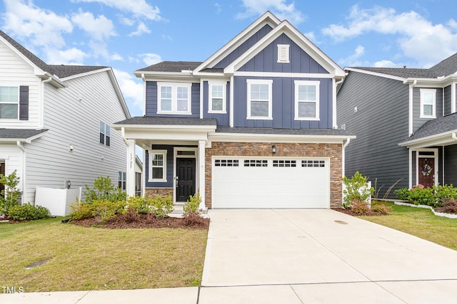 1725 Winter Jasmine Ln, Wake Forest, NC 27587 - craftsman-style home featuring board and batten siding, driveway, a front lawn, and a garage