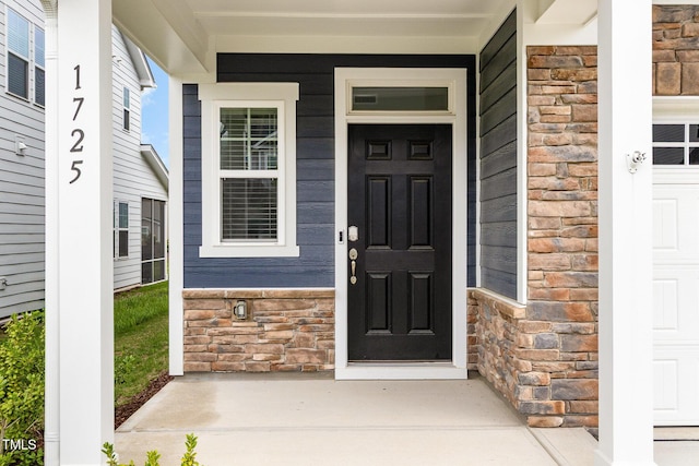 1725 Winter Jasmine Ln, Wake Forest, NC 27587 - property entrance featuring stone siding and a porch