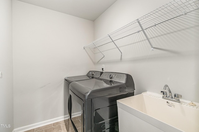 1725 Winter Jasmine Ln, Wake Forest, NC 27587 - laundry room featuring washing machine and dryer and baseboards