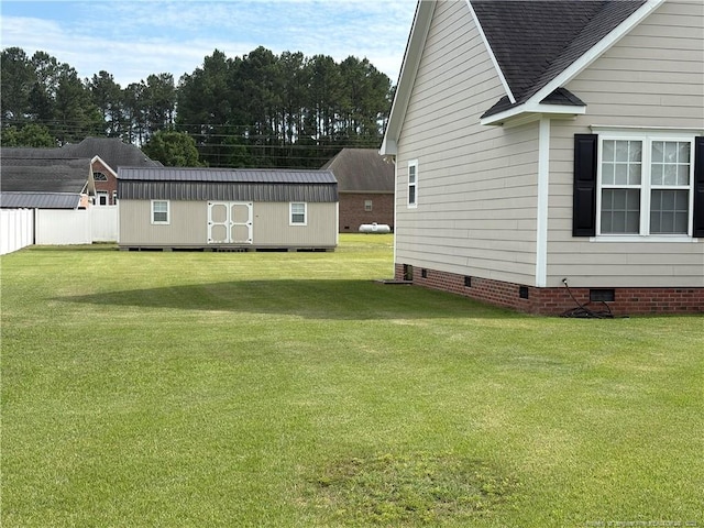 135 Paulownia Dr, Saint Pauls, NC 28384 - view of yard featuring an outdoor structure