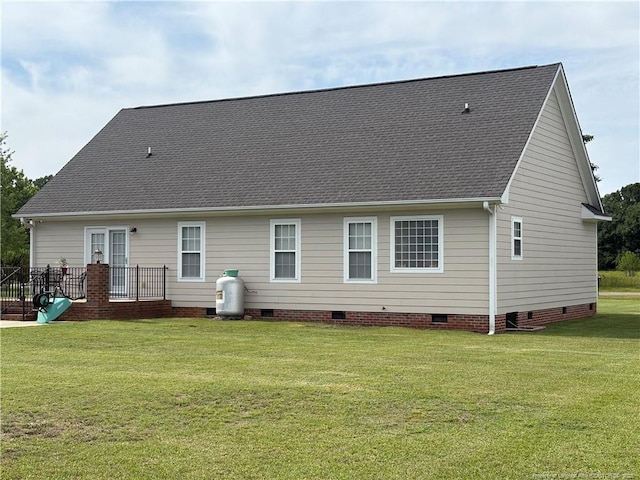 135 Paulownia Dr, Saint Pauls, NC 28384 - back of house featuring crawl space, a lawn, and a shingled roof