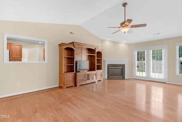 3027 Maple Ave Unit A-1, Burlington, NC 27215 - unfurnished living room featuring light wood-style floors, ceiling fan, a premium fireplace, lofted ceiling, and baseboards