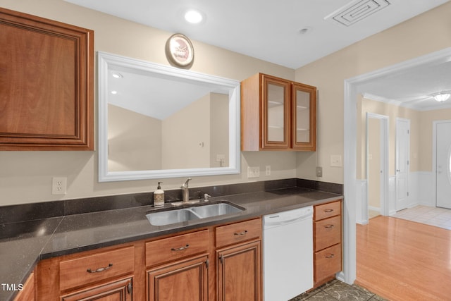 3027 Maple Ave Unit A-1, Burlington, NC 27215 - kitchen with dishwasher, a sink, brown cabinetry, and glass insert cabinets