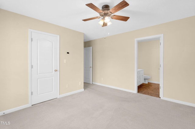 3027 Maple Ave Unit A-1, Burlington, NC 27215 - unfurnished bedroom with carpet floors, connected bathroom, baseboards, and ceiling fan