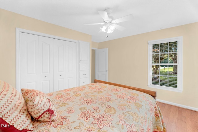 3027 Maple Ave Unit A-1, Burlington, NC 27215 - bedroom featuring wood finished floors, a closet, baseboards, and ceiling fan