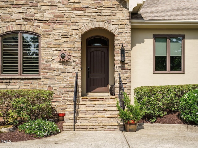 410 Mountain Laurel, Chapel Hill, NC 27517 - entrance to property with stucco siding, stone siding, and roof with shingles
