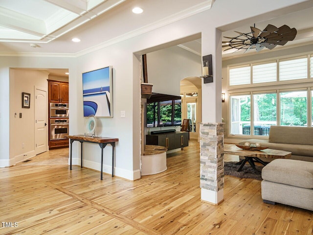 410 Mountain Laurel, Chapel Hill, NC 27517 - living room featuring crown molding, light wood-style floors, arched walkways, recessed lighting, and baseboards
