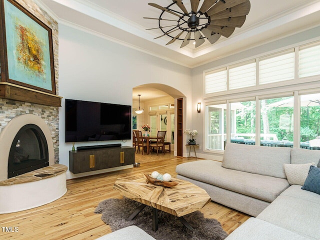 410 Mountain Laurel, Chapel Hill, NC 27517 - living room with ornamental molding, arched walkways, light wood-style floors, a towering ceiling, and ceiling fan