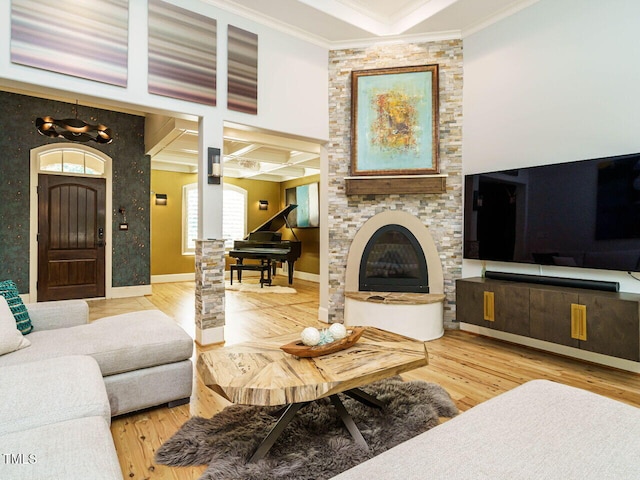 410 Mountain Laurel, Chapel Hill, NC 27517 - living area with ornamental molding, wood finished floors, a fireplace, a chandelier, and baseboards