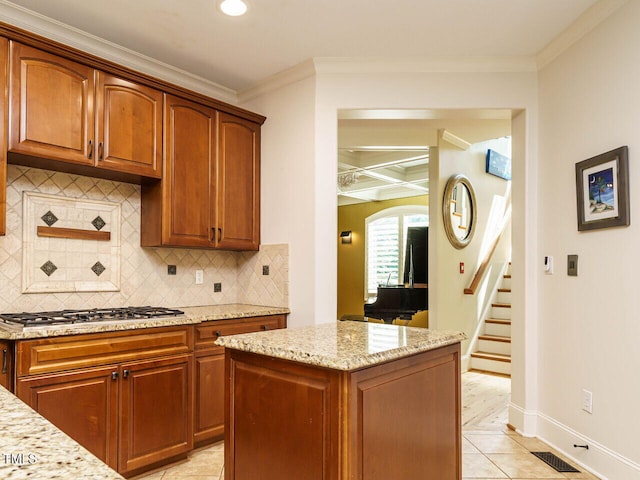 410 Mountain Laurel, Chapel Hill, NC 27517 - kitchen with stainless steel gas cooktop, light stone counters, ornamental molding, recessed lighting, and baseboards