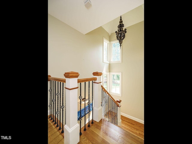 410 Mountain Laurel, Chapel Hill, NC 27517 - staircase with lofted ceiling, wood finished floors, and baseboards