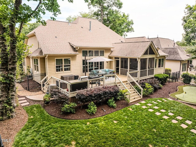 410 Mountain Laurel, Chapel Hill, NC 27517 - rear view of house featuring an outdoor living space, an area to practice putting, a sunroom, roof with shingles, and a deck