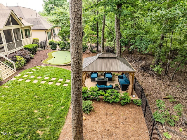 410 Mountain Laurel, Chapel Hill, NC 27517 - view of yard featuring a putting green, an outdoor hangout area, a sunroom, and a patio area