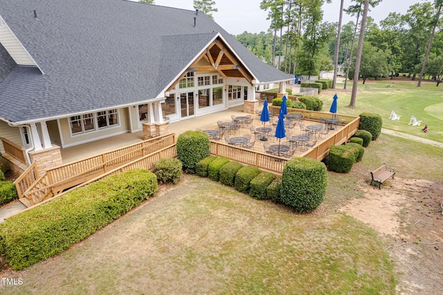 410 Mountain Laurel, Chapel Hill, NC 27517 - rear view of property with roof with shingles, outdoor dining area, a wooden deck, a lawn, and view of wooded area