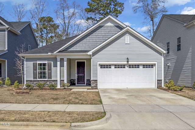 244 Chateau Way, Angier, NC 27501 - view of front of property featuring stone siding, an attached garage, and driveway
