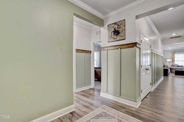 244 Chateau Way, Angier, NC 27501 - hallway featuring wood finished floors, ornamental molding, and recessed lighting