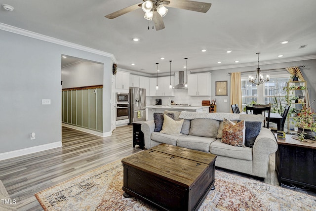 244 Chateau Way, Angier, NC 27501 - living room with ceiling fan, a chandelier, ornamental molding, light wood finished floors, and recessed lighting