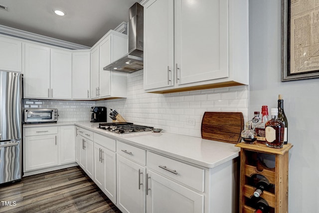244 Chateau Way, Angier, NC 27501 - kitchen with wall chimney exhaust hood, stainless steel appliances, light countertops, white cabinets, and wood finished floors
