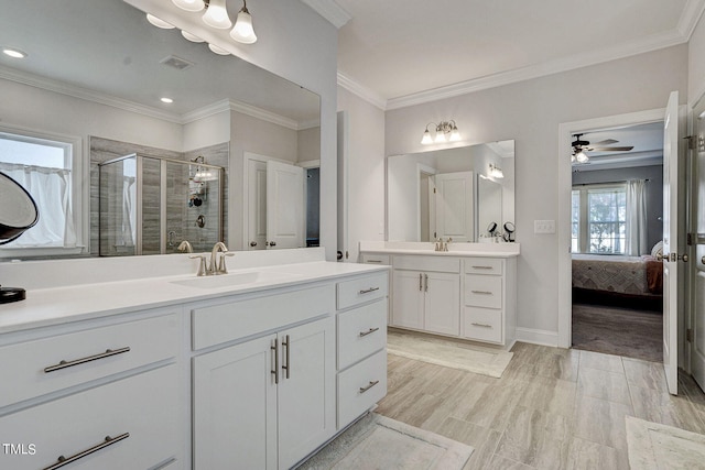 244 Chateau Way, Angier, NC 27501 - ensuite bathroom featuring a shower stall, two vanities, ornamental molding, ceiling fan, and recessed lighting