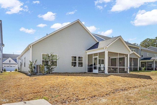 244 Chateau Way, Angier, NC 27501 - back of property with a sunroom and a yard