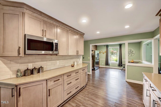750 Greenleaf Rd, Angier, NC 27501 - kitchen with appliances with stainless steel finishes, light countertops, wood finished floors, decorative backsplash, and baseboards